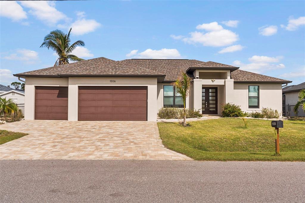 a front view of a house with garden