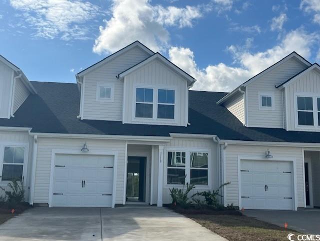 View of front of property with a garage