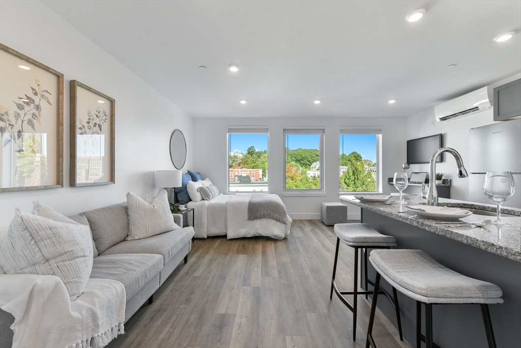 a living room with furniture and a large window