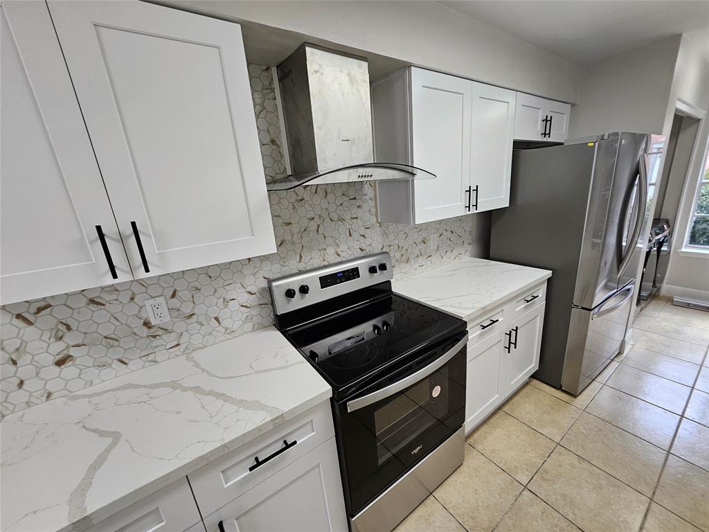 a kitchen with a stove microwave and refrigerator