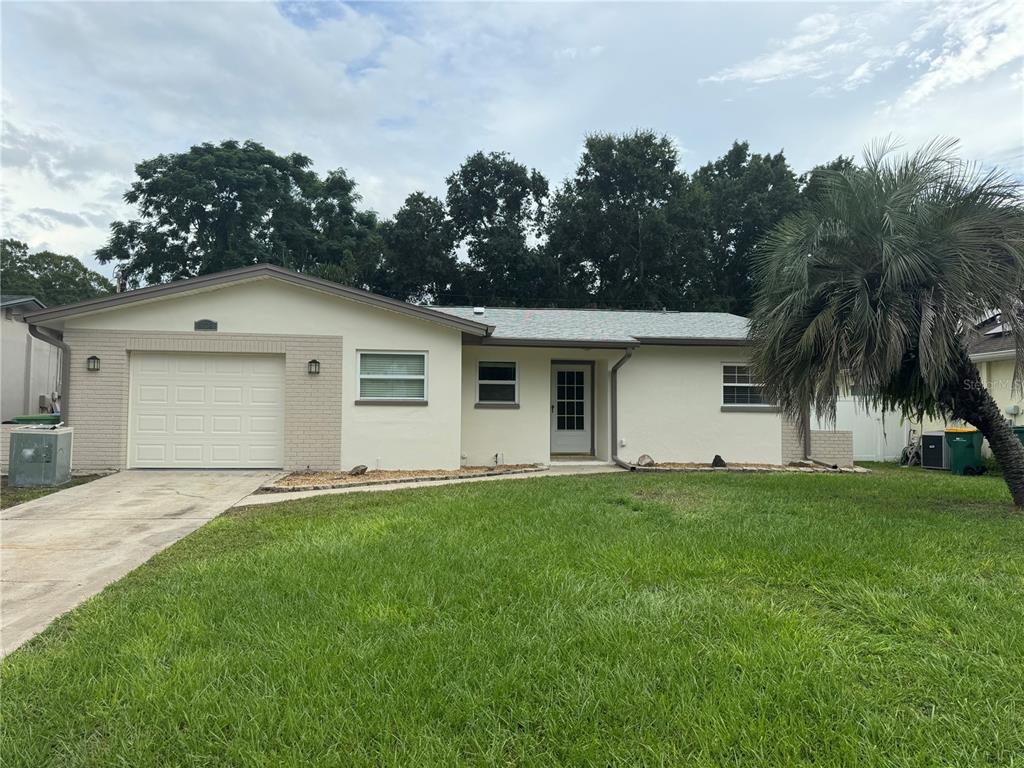 front view of a house with a yard