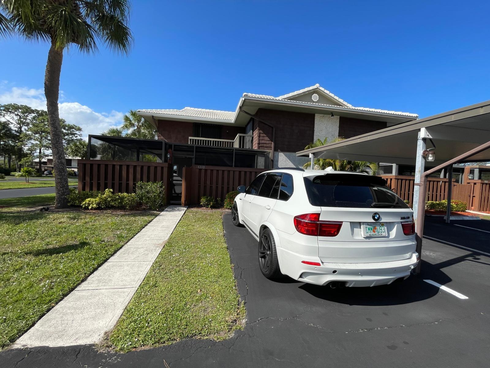 a front view of house with yard and entertaining space