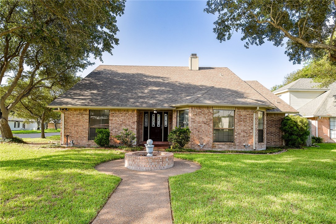 a front view of house with yard and outdoor seating