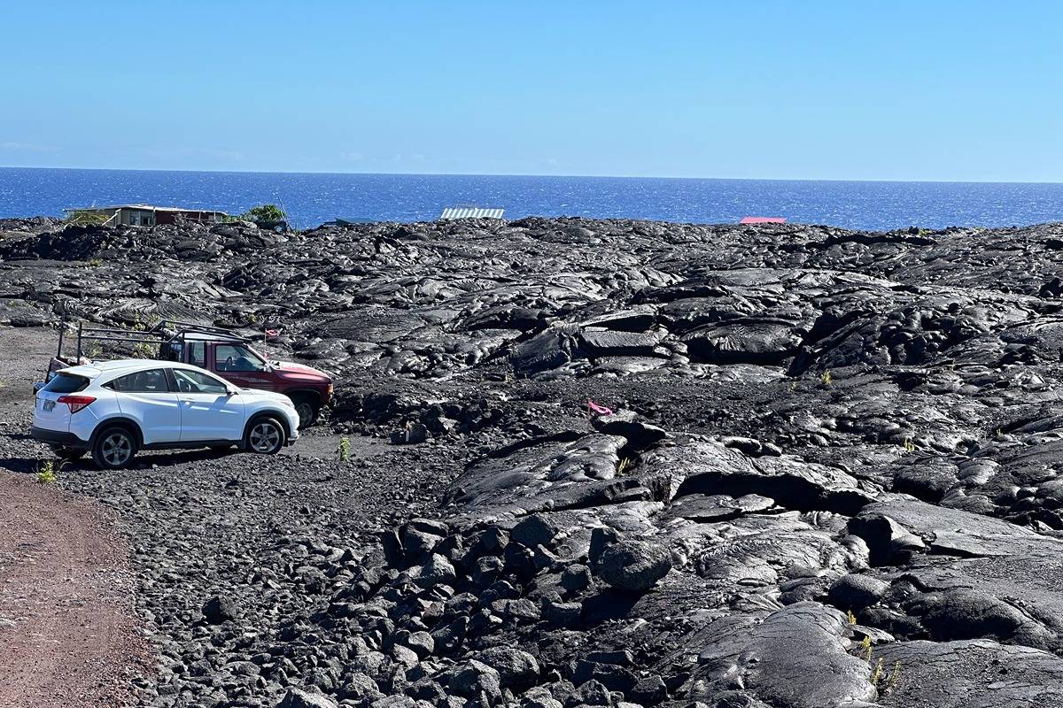 a view of car parked in parking lot of house