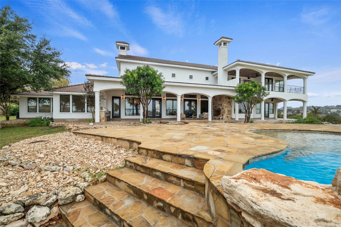 a front view of a building with a swimming pool