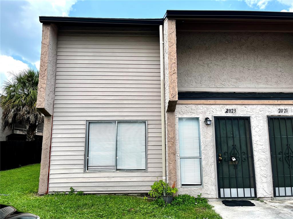 a view of a house with a door and a window