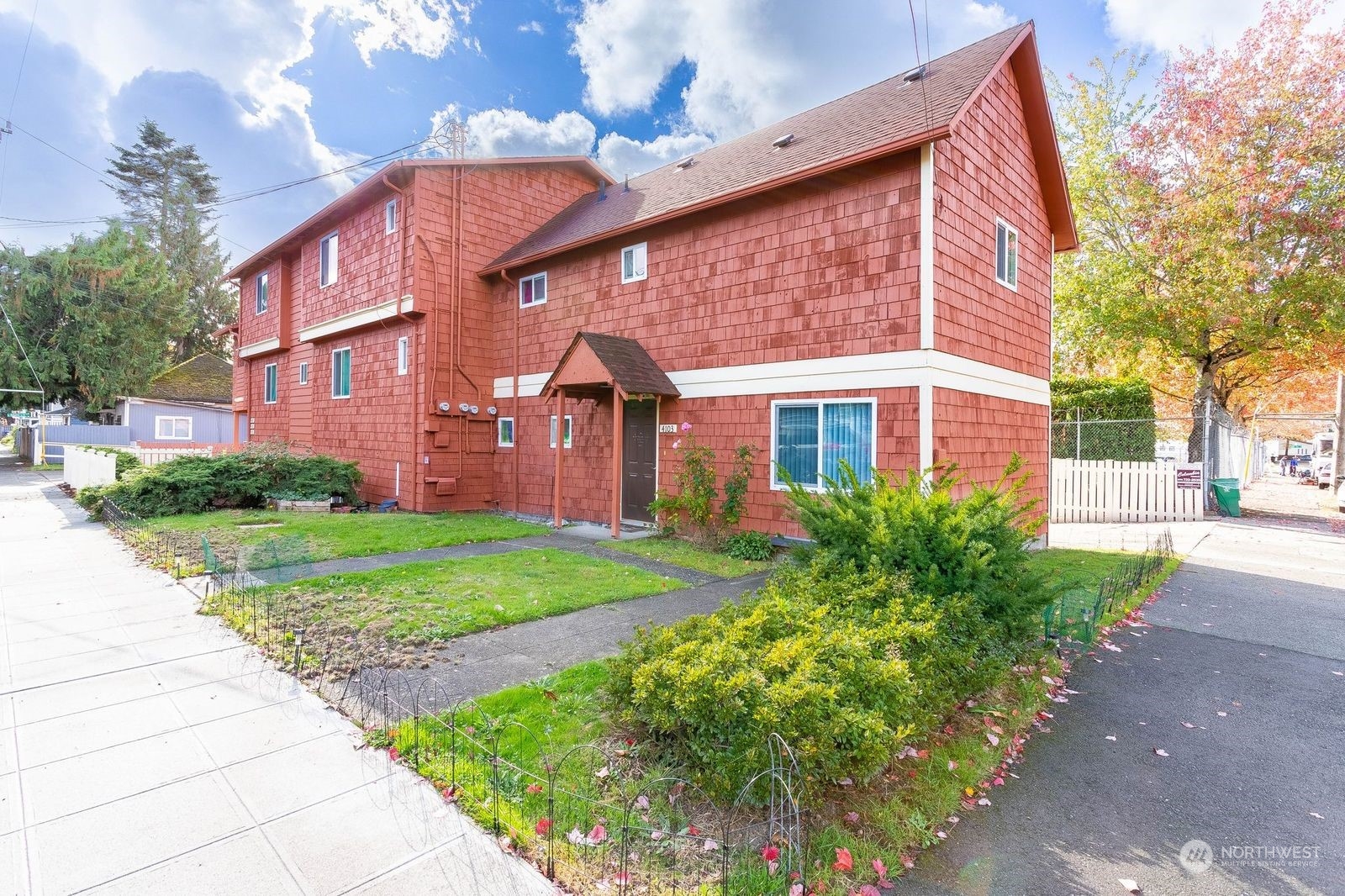 a view of a brick building next to a yard