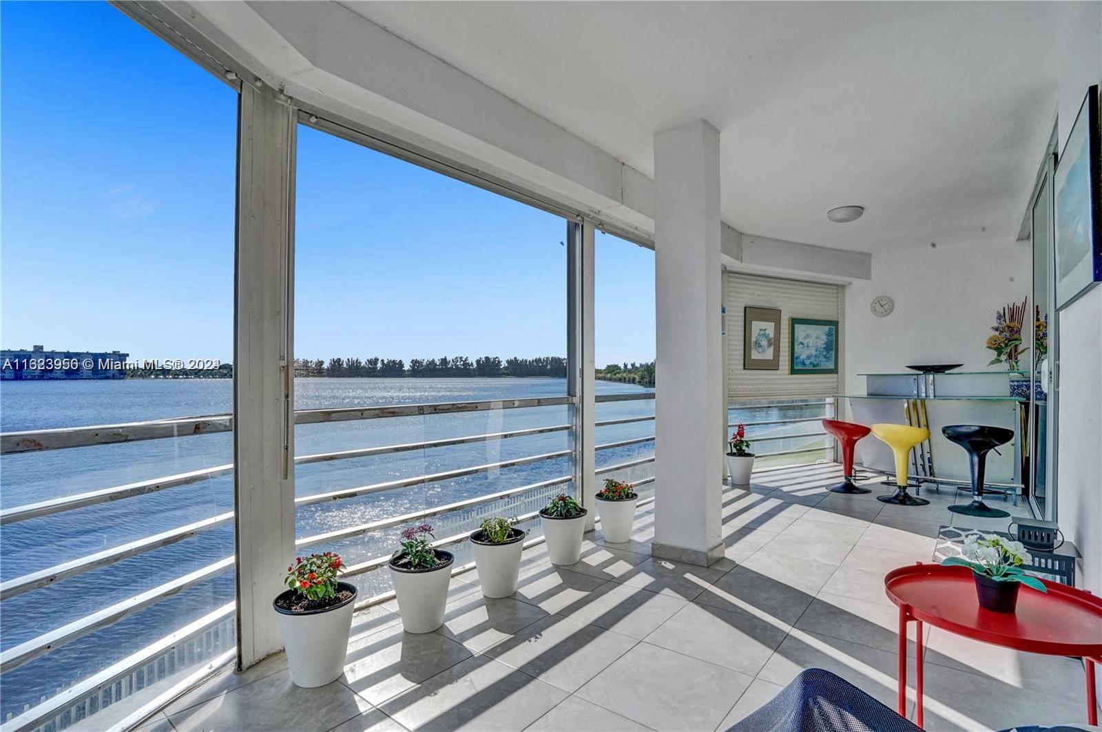 a room with gym equipment and the view of living room