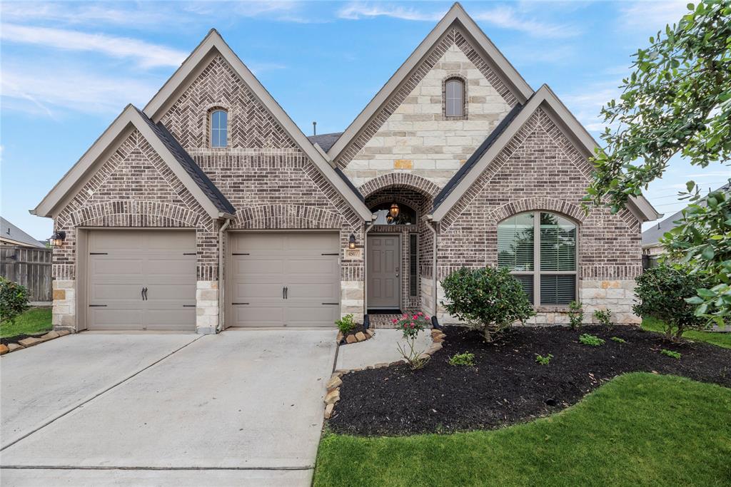 Welcome home! This 4-bedroom, 2.5 bathroom property boasts numerous high-end upgrades and thoughtful features designed for comfort, convenience, and style. The home's exterior boasts a sophisticated blend of brick and stone, creating a timeless and durable facade.