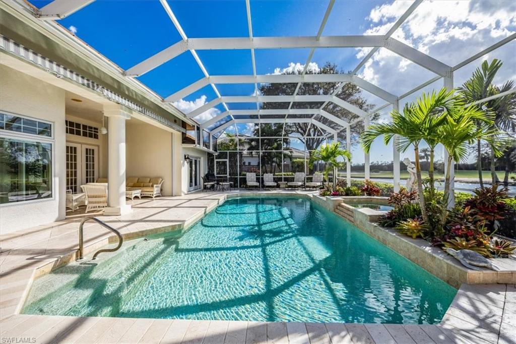 a view of a backyard with sitting area