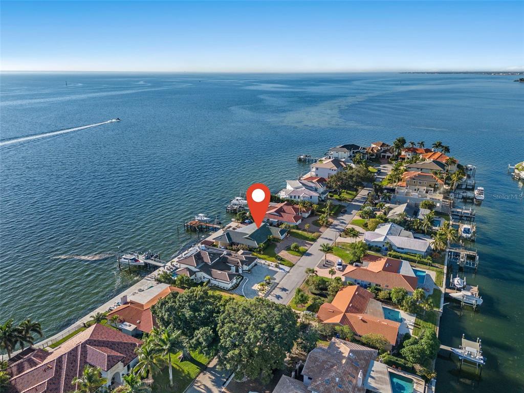 an aerial view of a house with a lake view