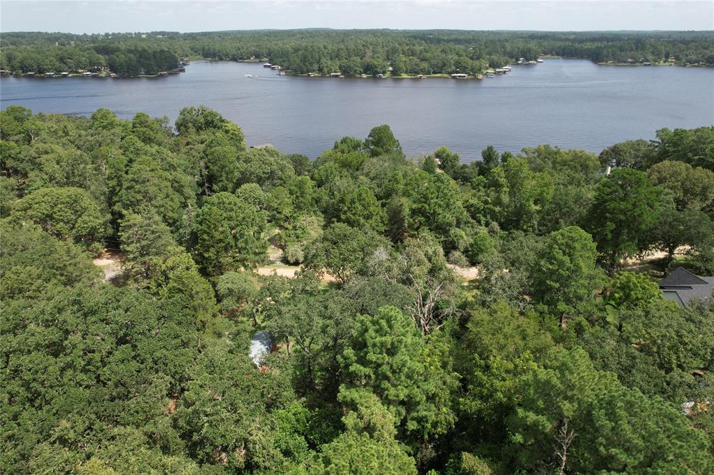 an aerial view of a houses with a lake view