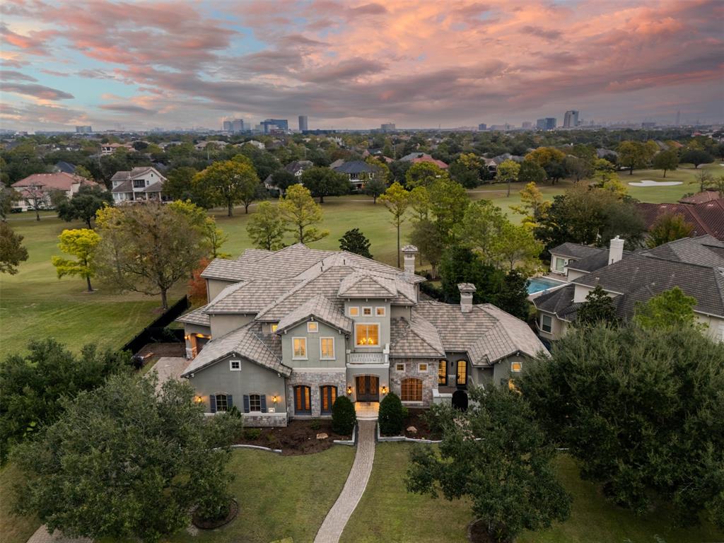 an aerial view of a house with a lake view