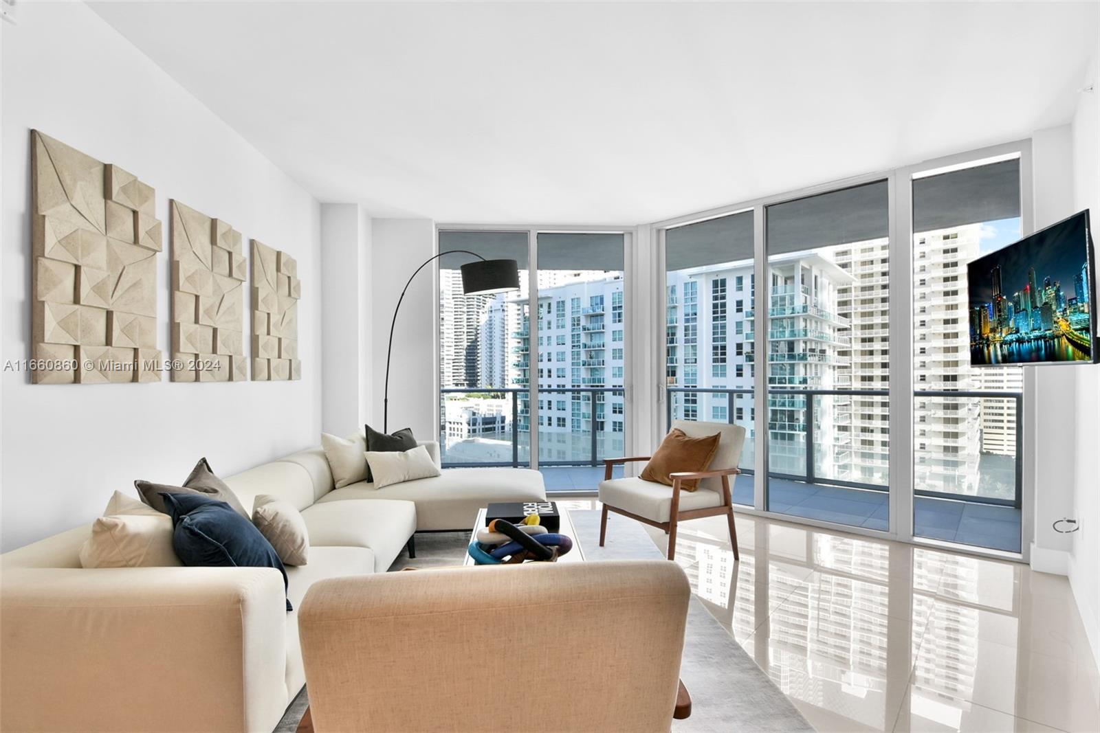 a living room with furniture and a flat screen tv