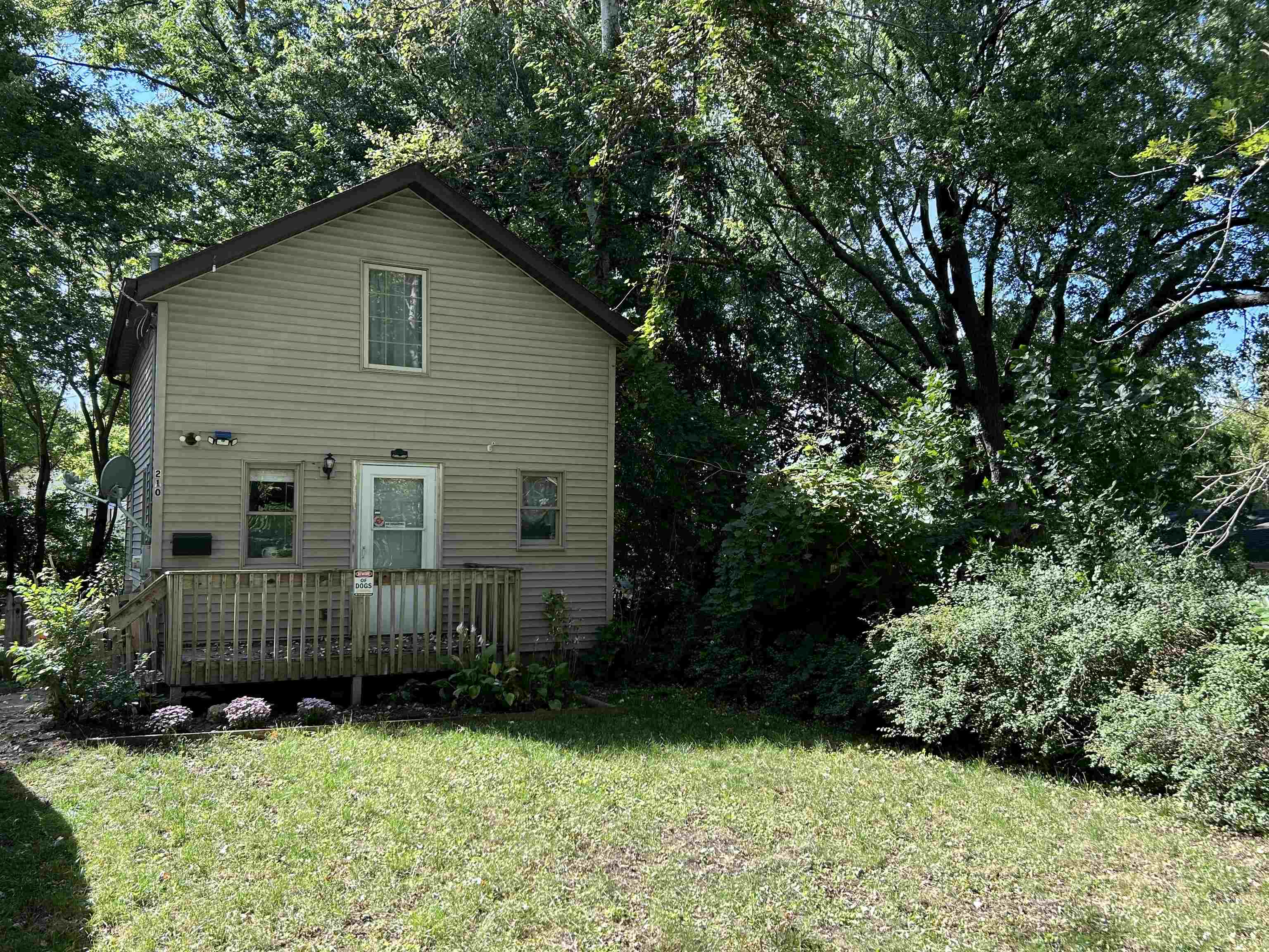 a view of backyard with green space