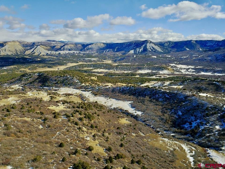 a view of a ocean with a mountain