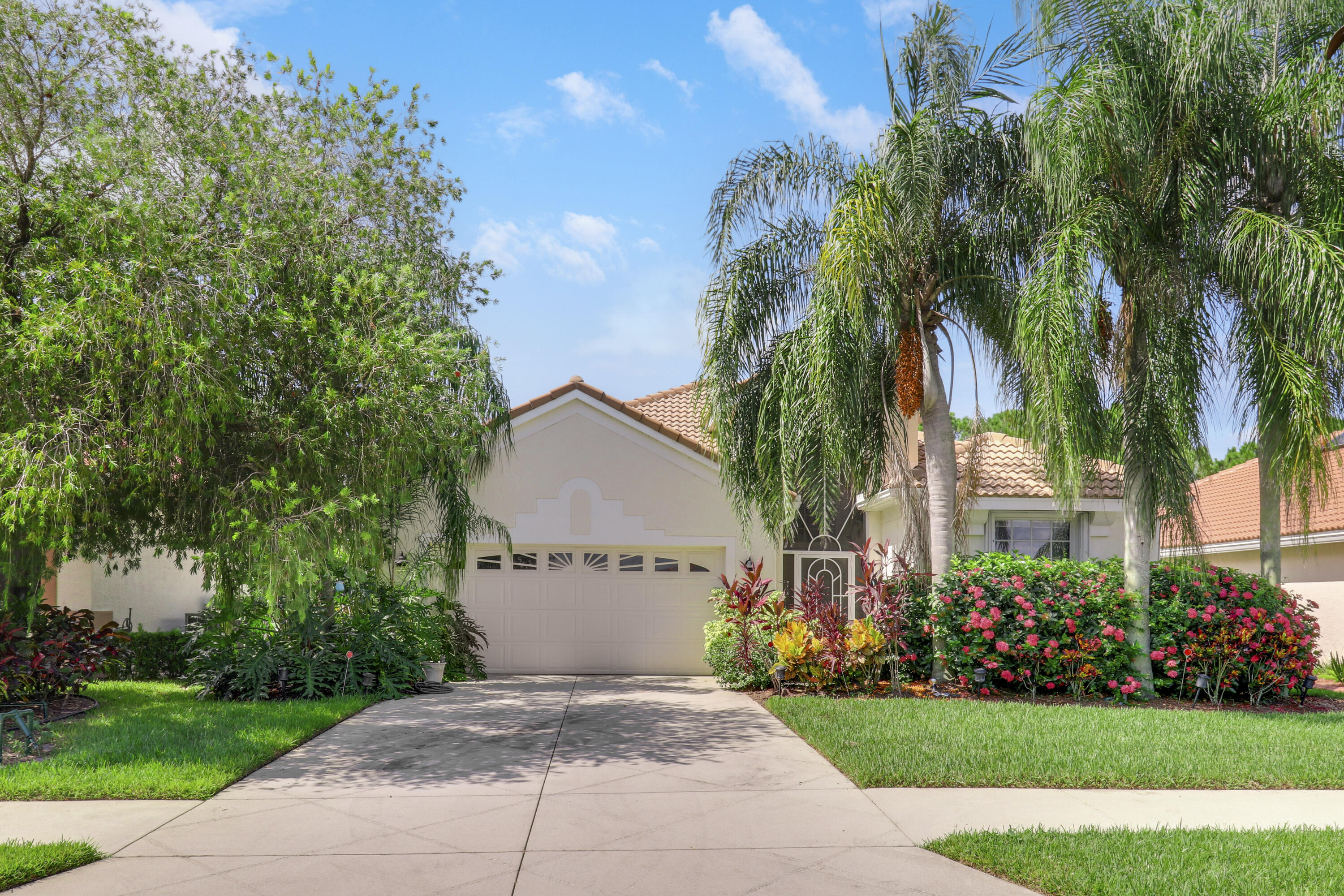 a front view of house and yard with green space