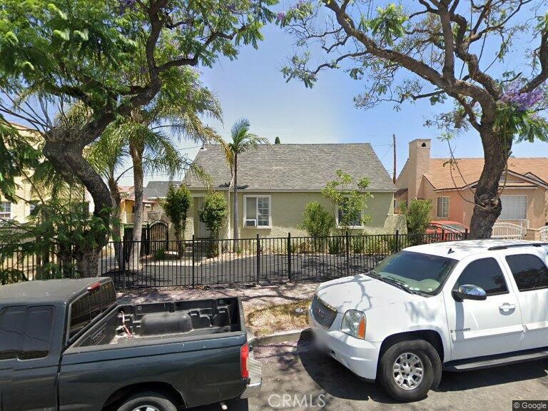 a view of a car parked in front of a house