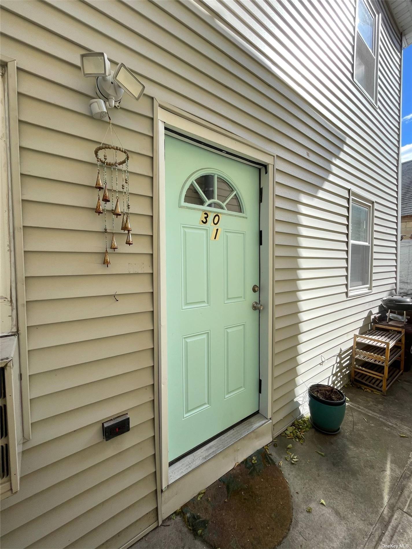 a view of a house with a door and wooden walls