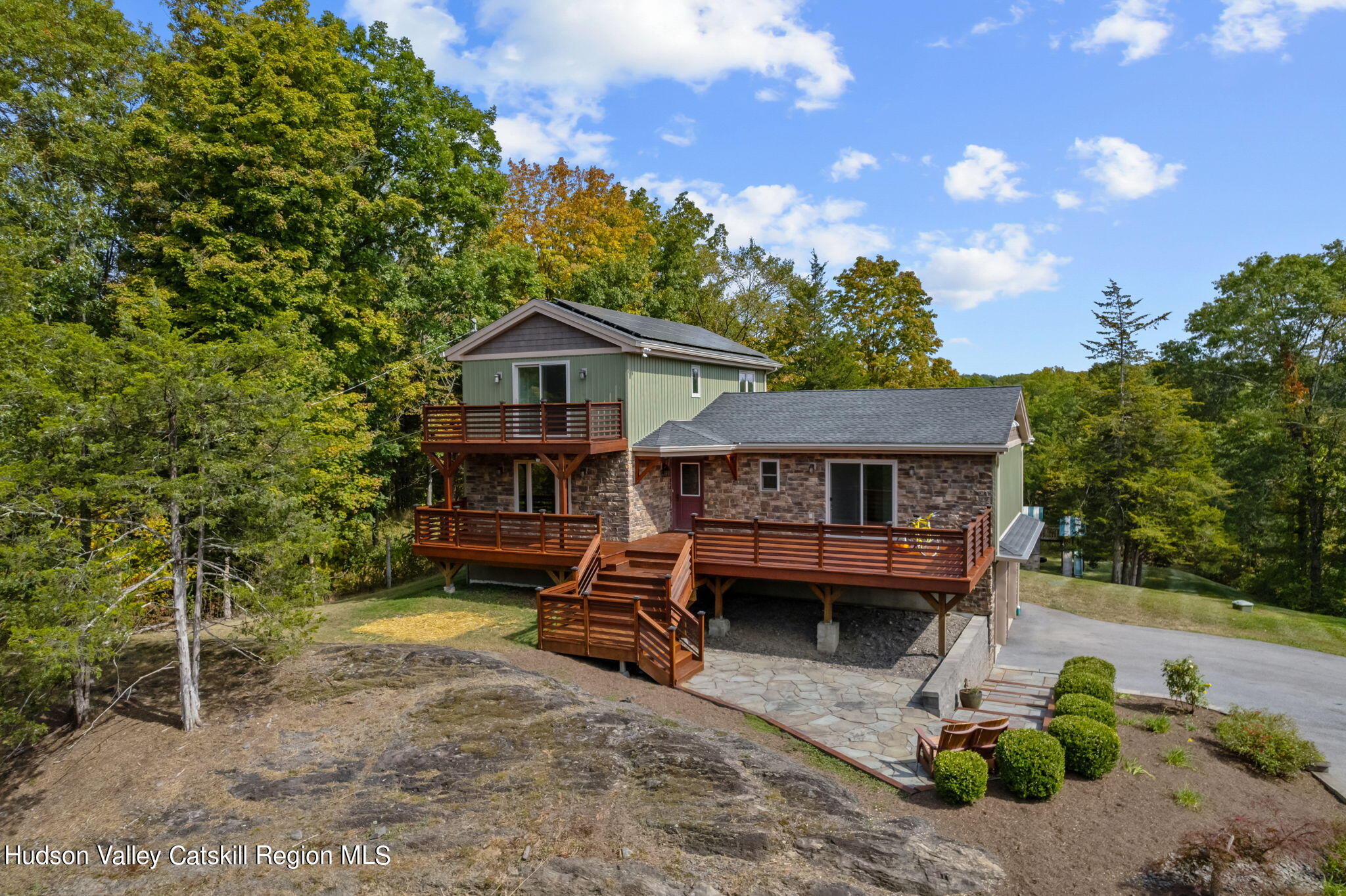 Front of house with wooden deck