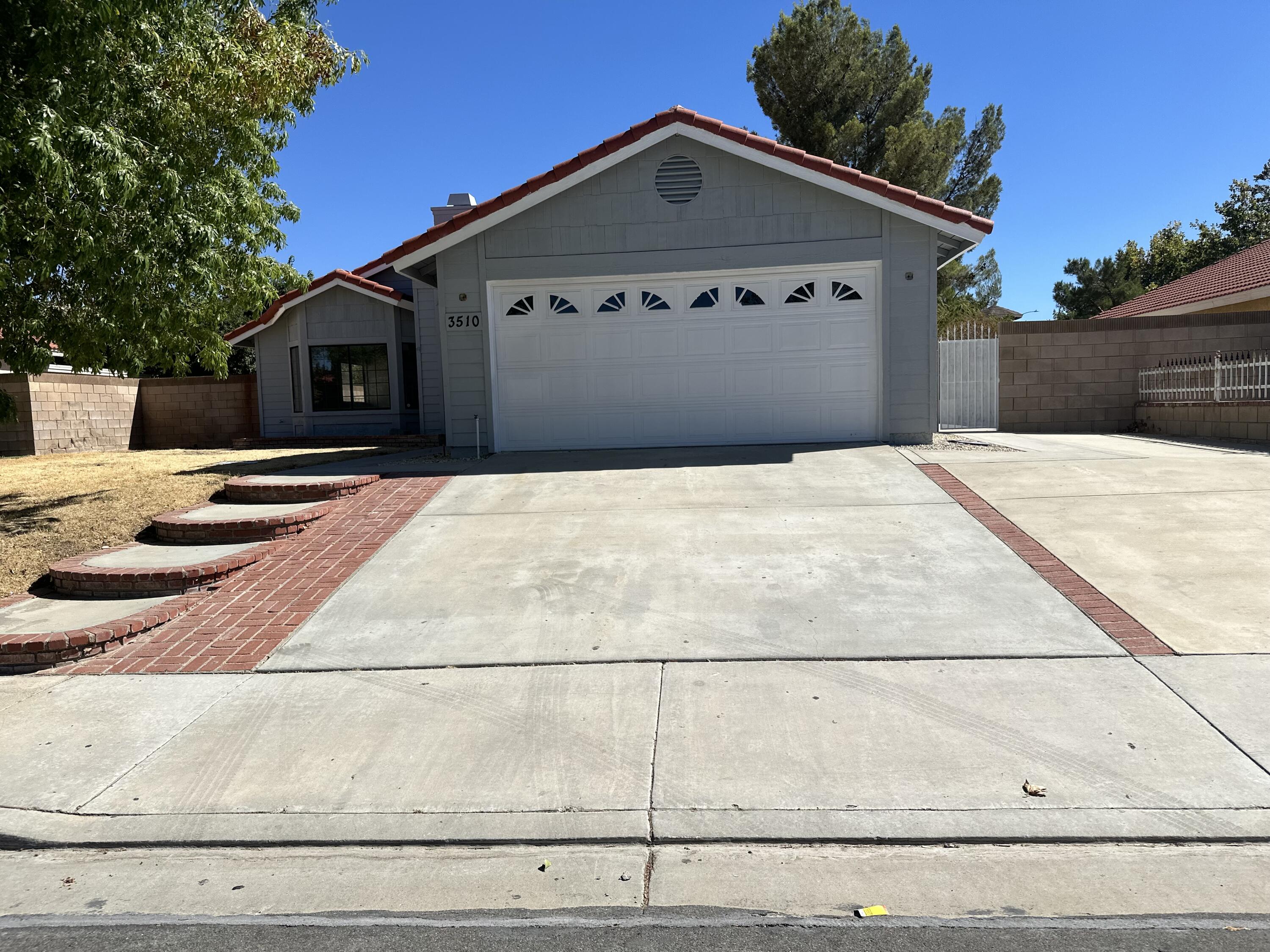 a front view of a house with yard