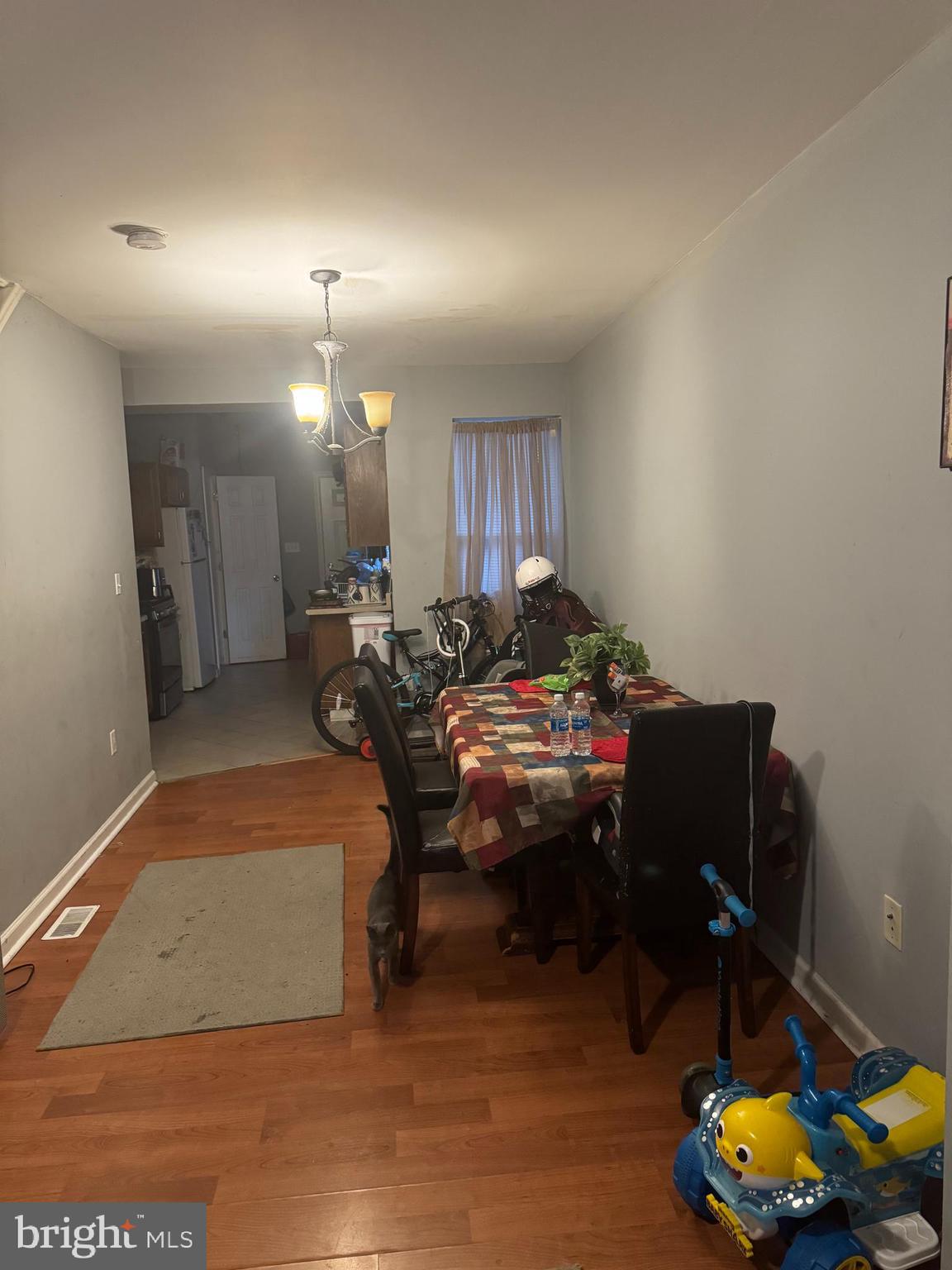 a living room filled with furniture and a wooden floor