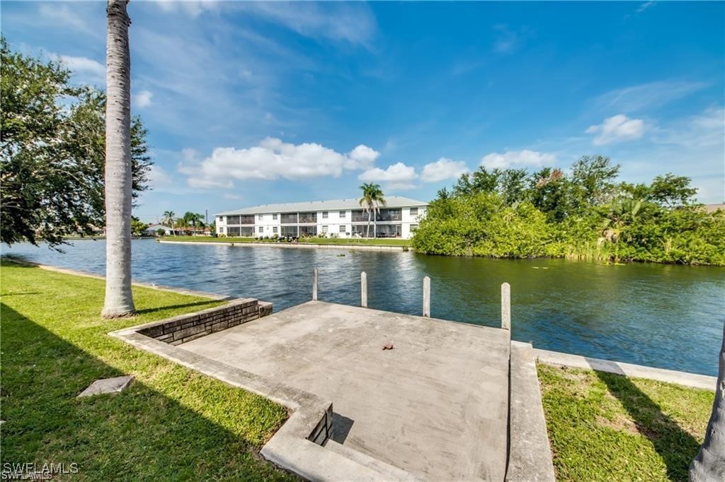 a view of a lake with a building in the background