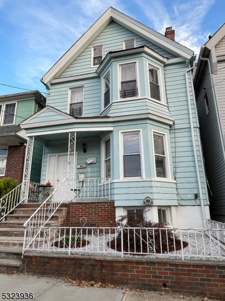 a front view of a house with balcony