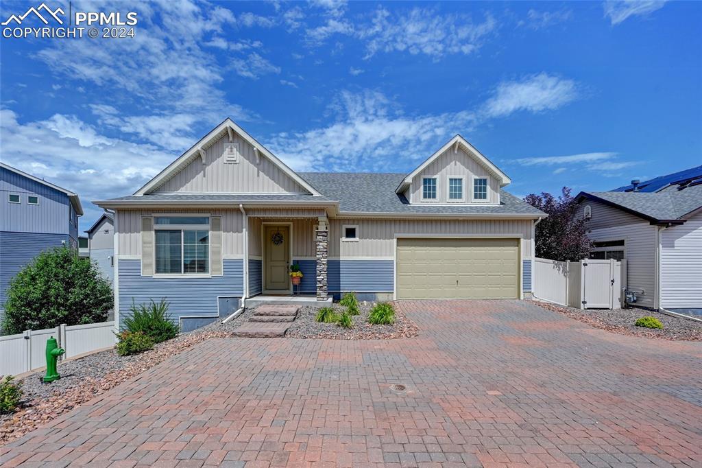 View of front of property with a garage