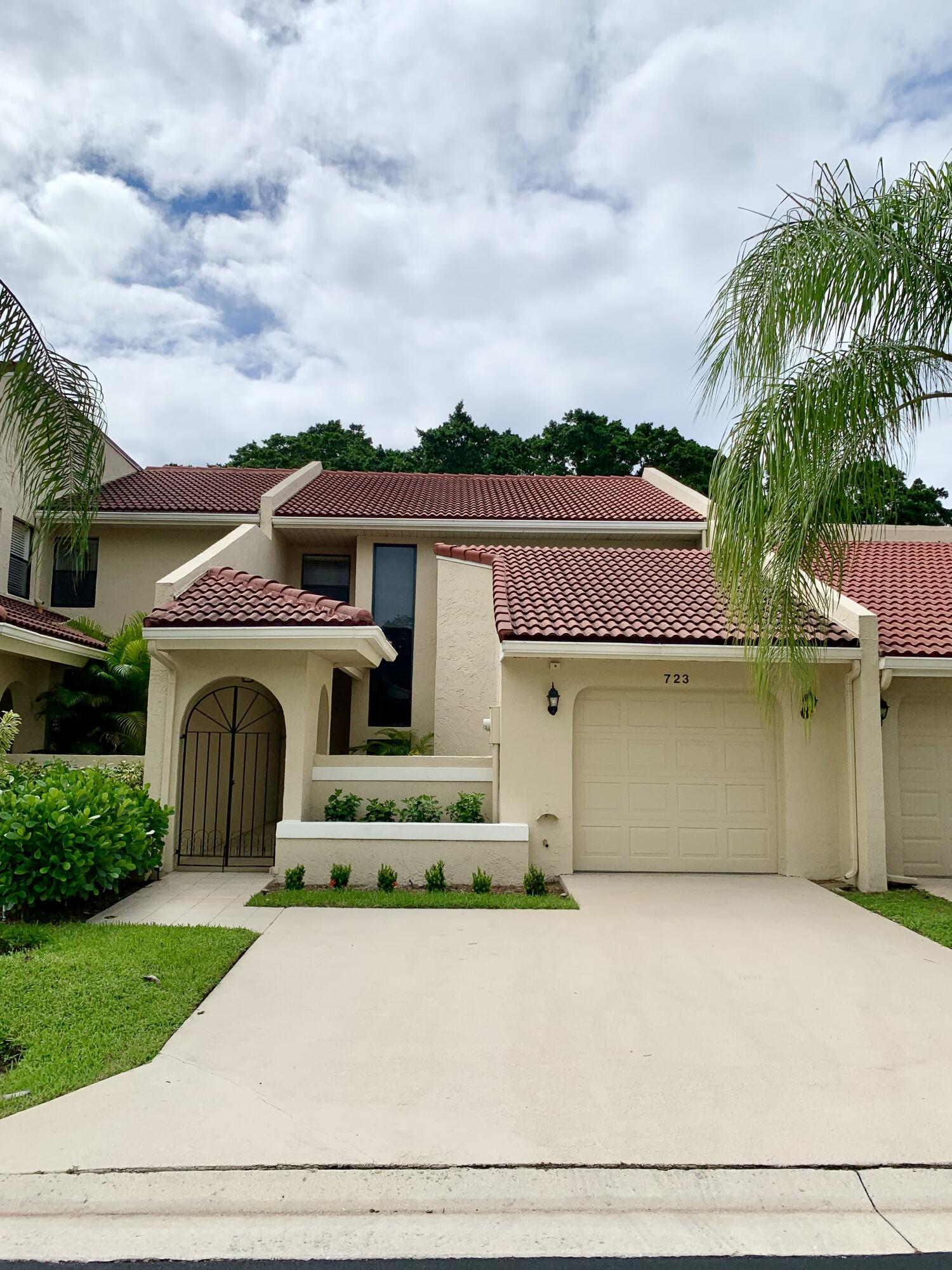 front view of a house with a garden