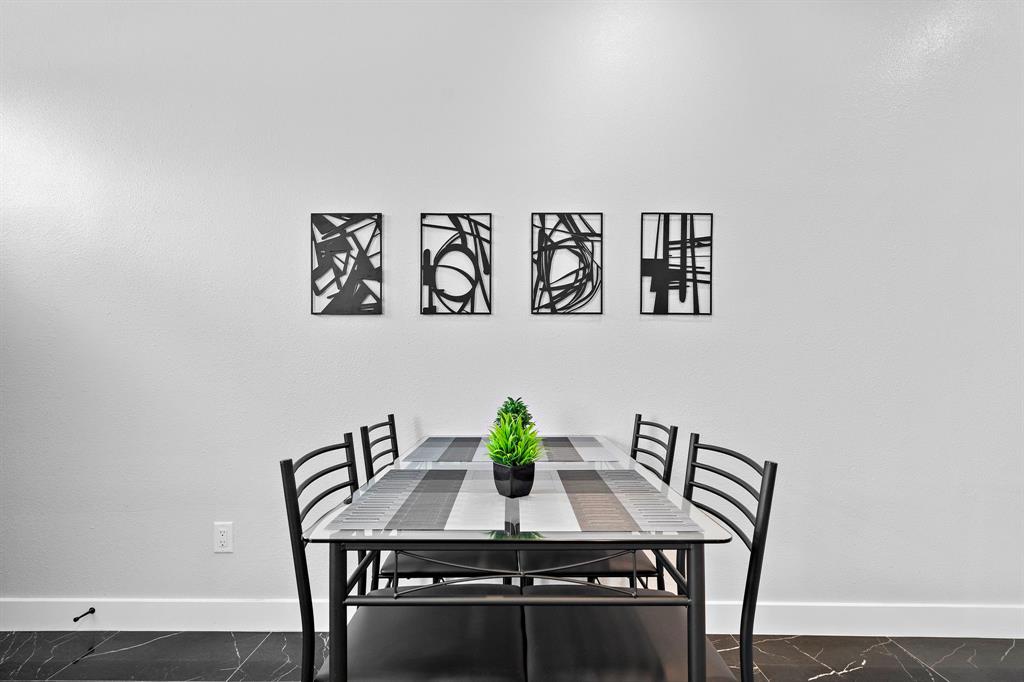 a view of a dining room with furniture