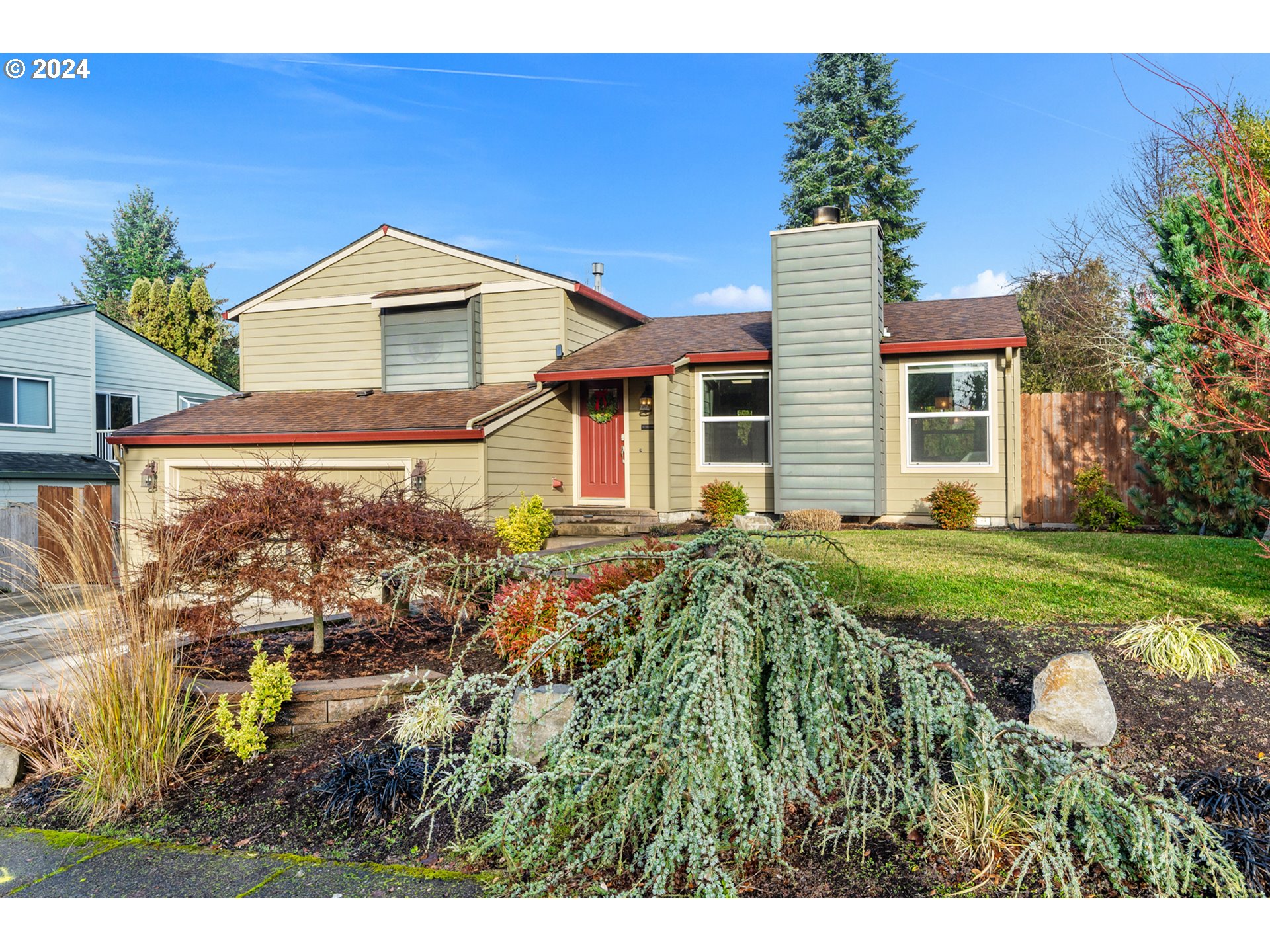 a house view with a garden space