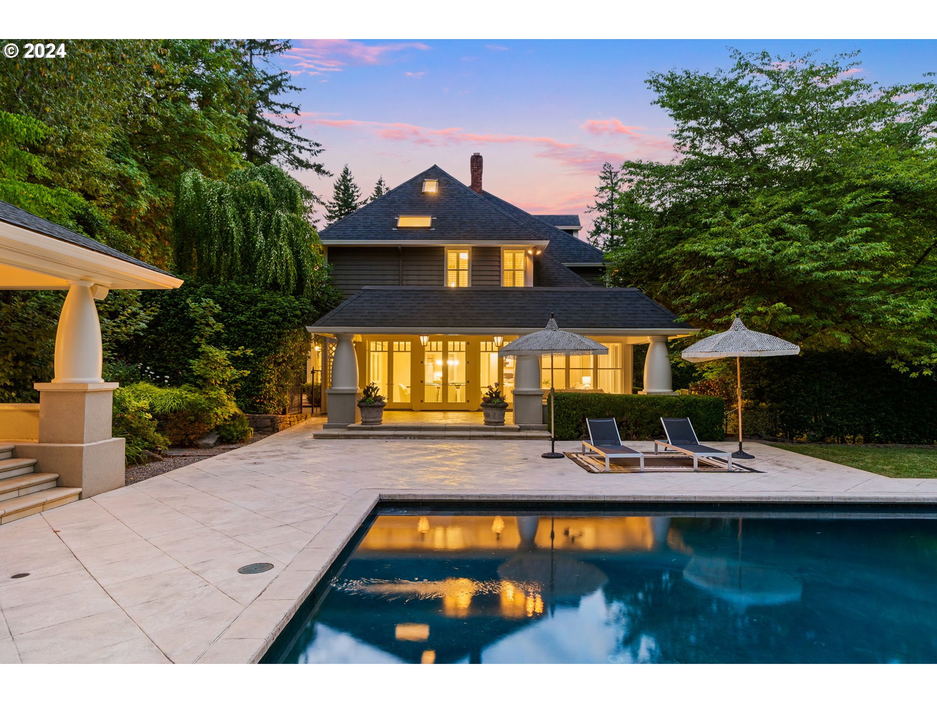 a front view of house with yard and outdoor seating