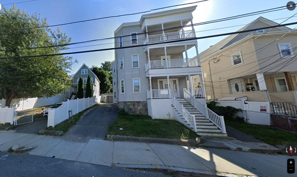 a view of a house with a yard