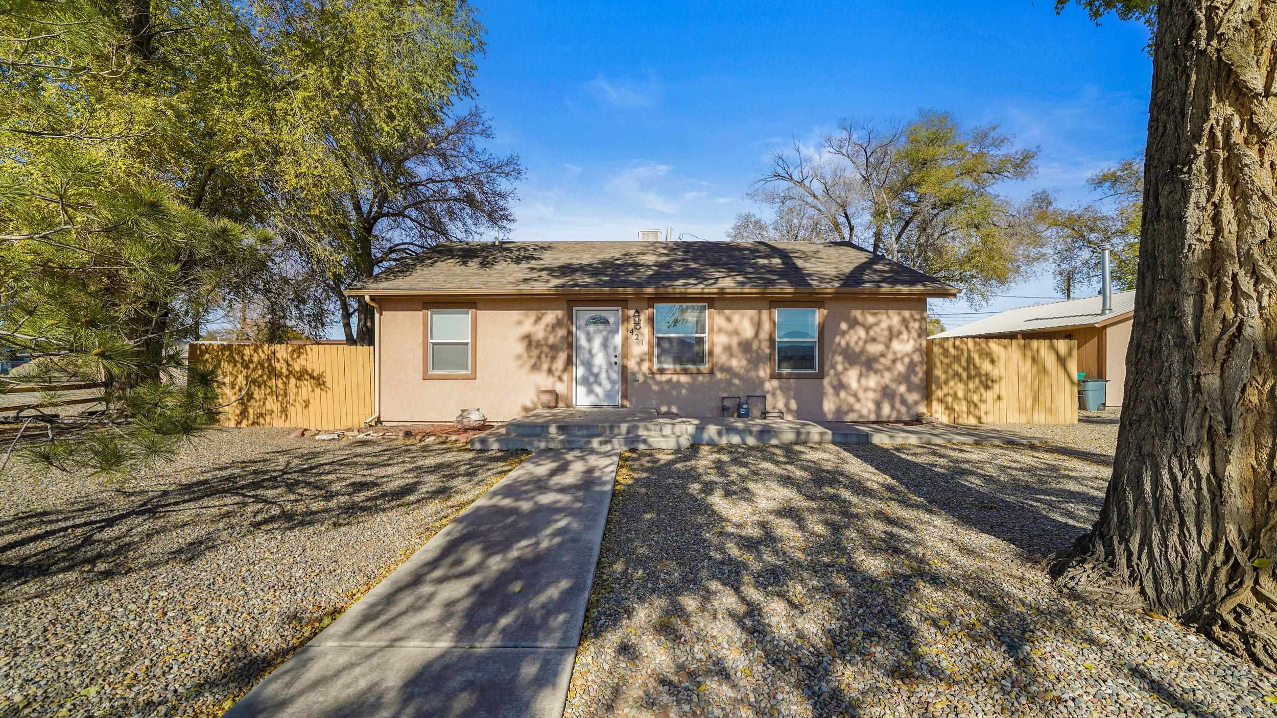 a view of a house with a tree