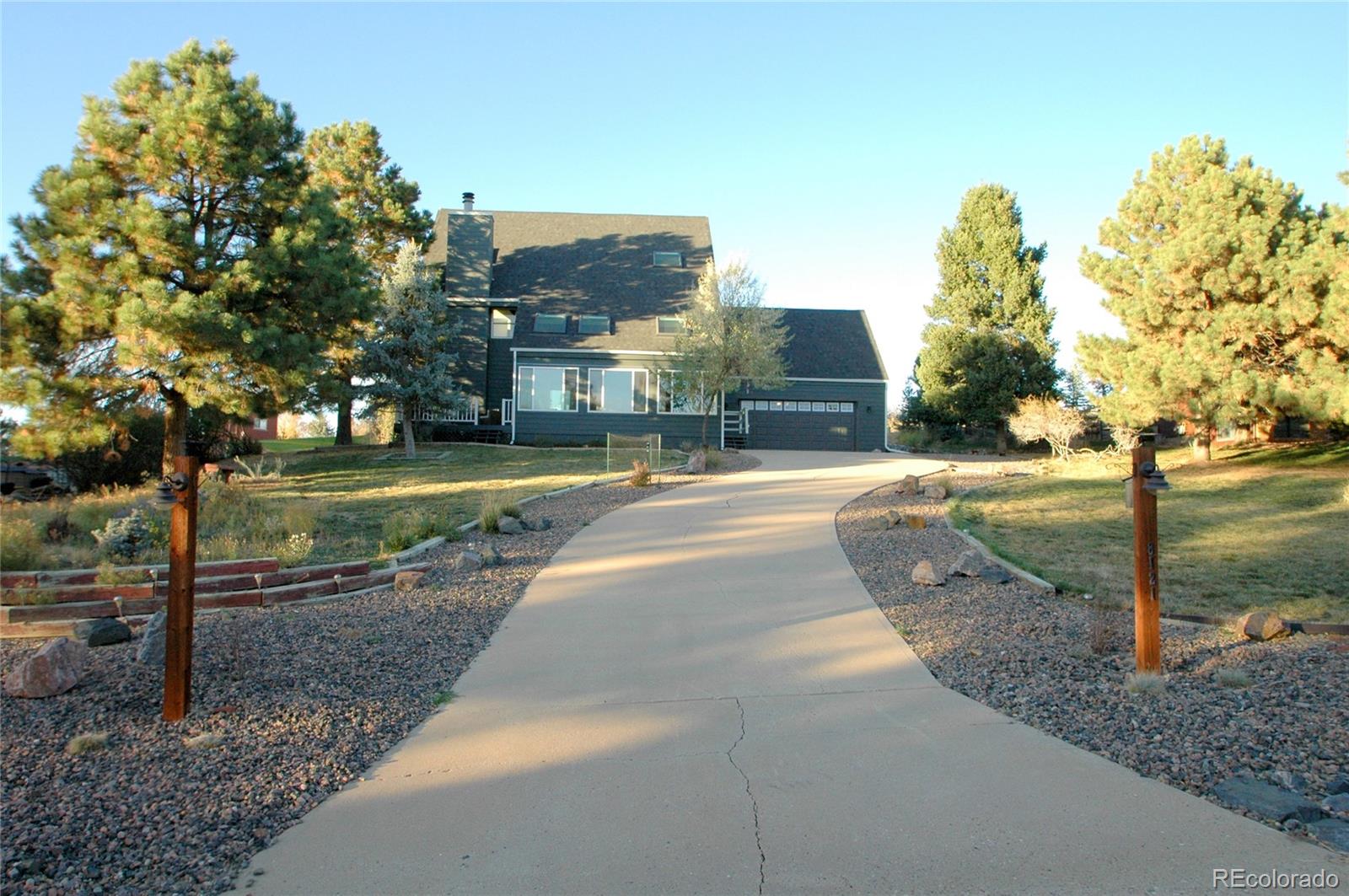 a view of a street with a building and a street sign