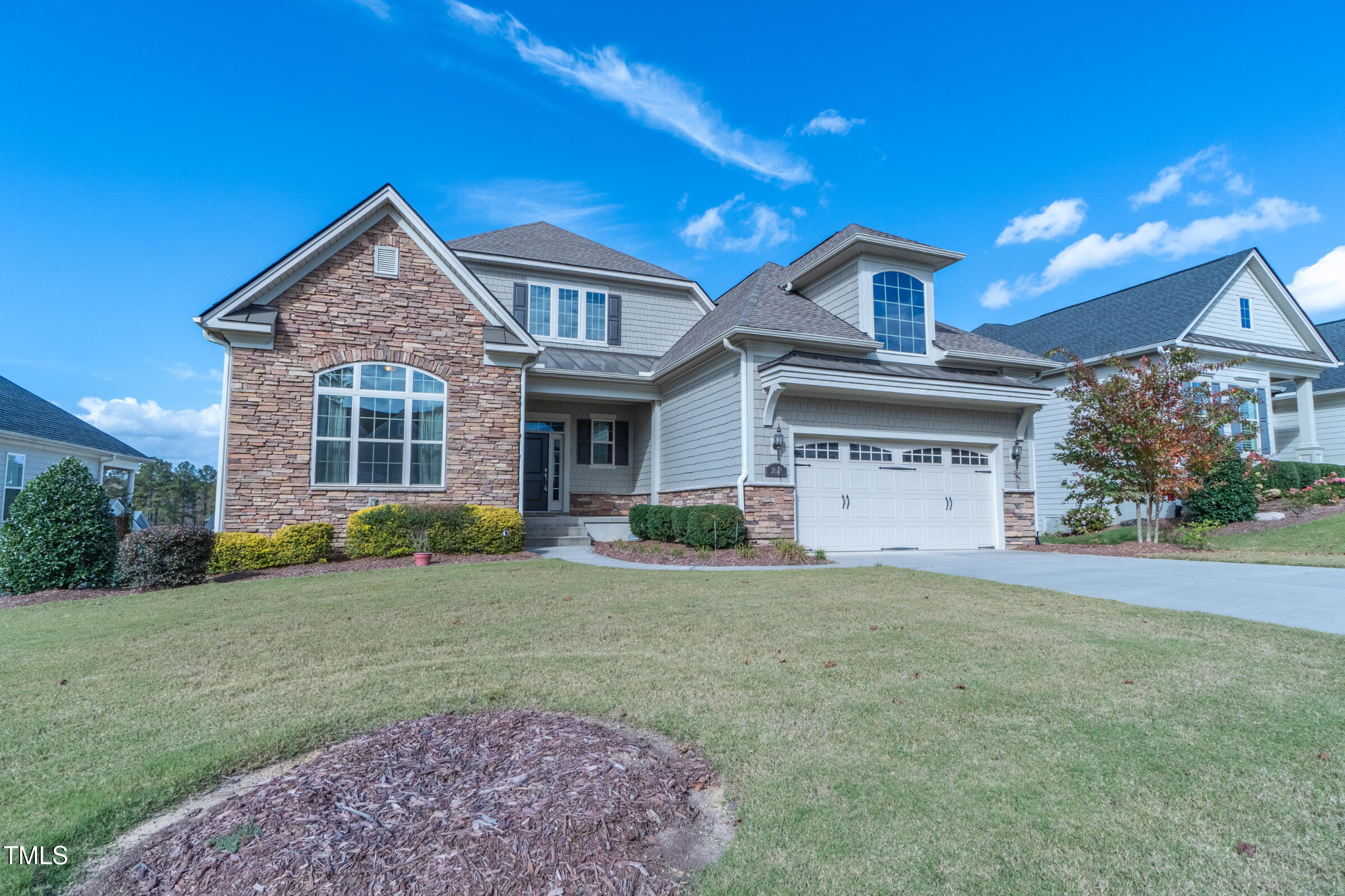 front view of a house with a yard