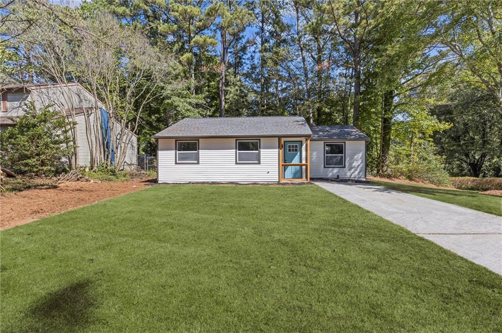 a front view of a house with a yard