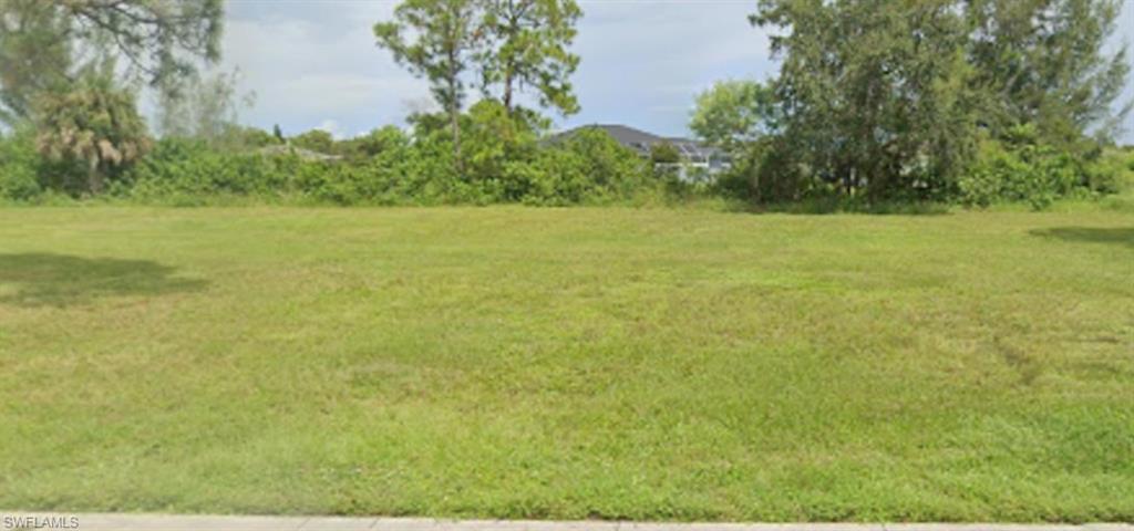 a view of a field with an outdoor space