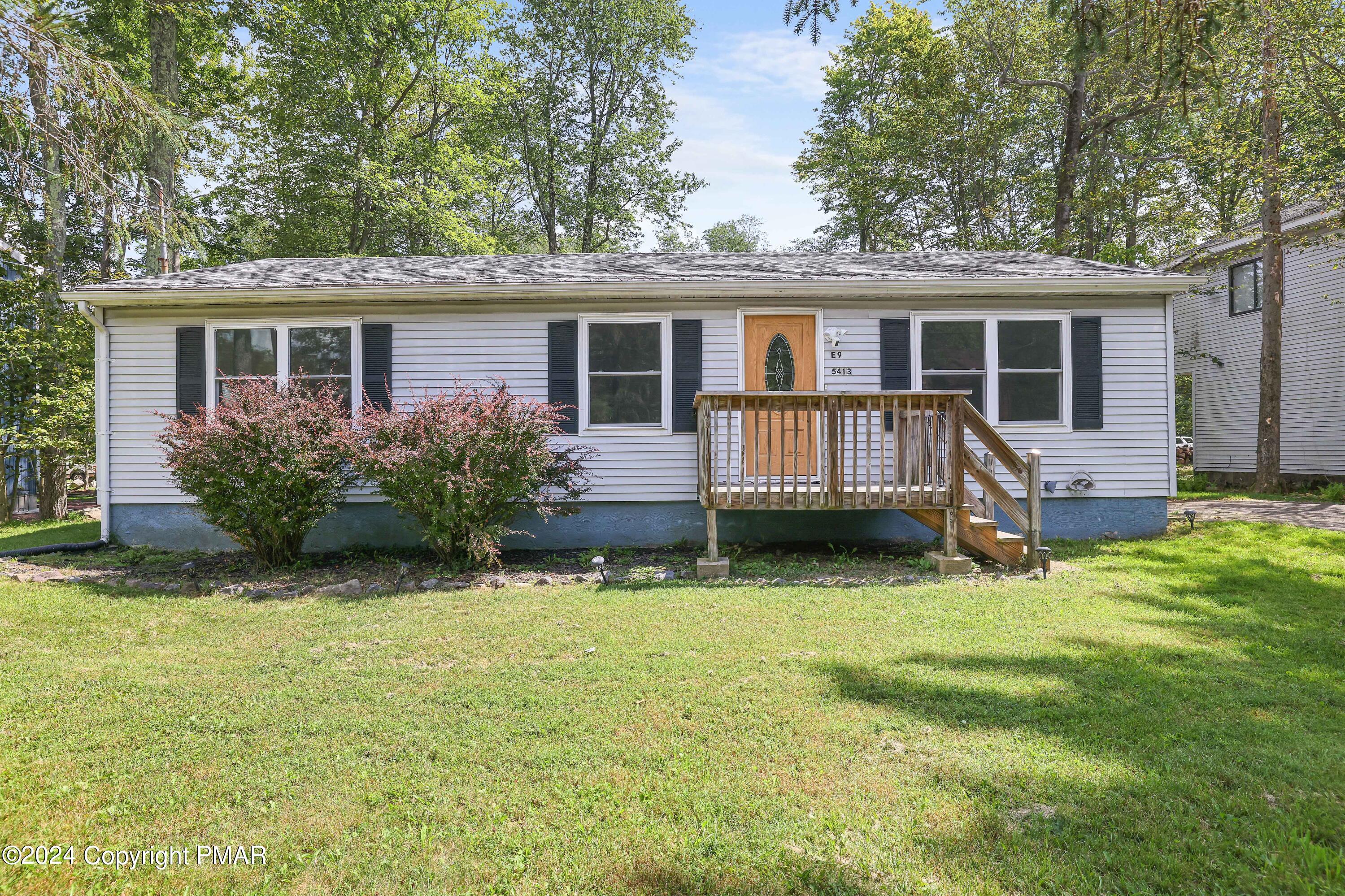 front view of a house with a yard