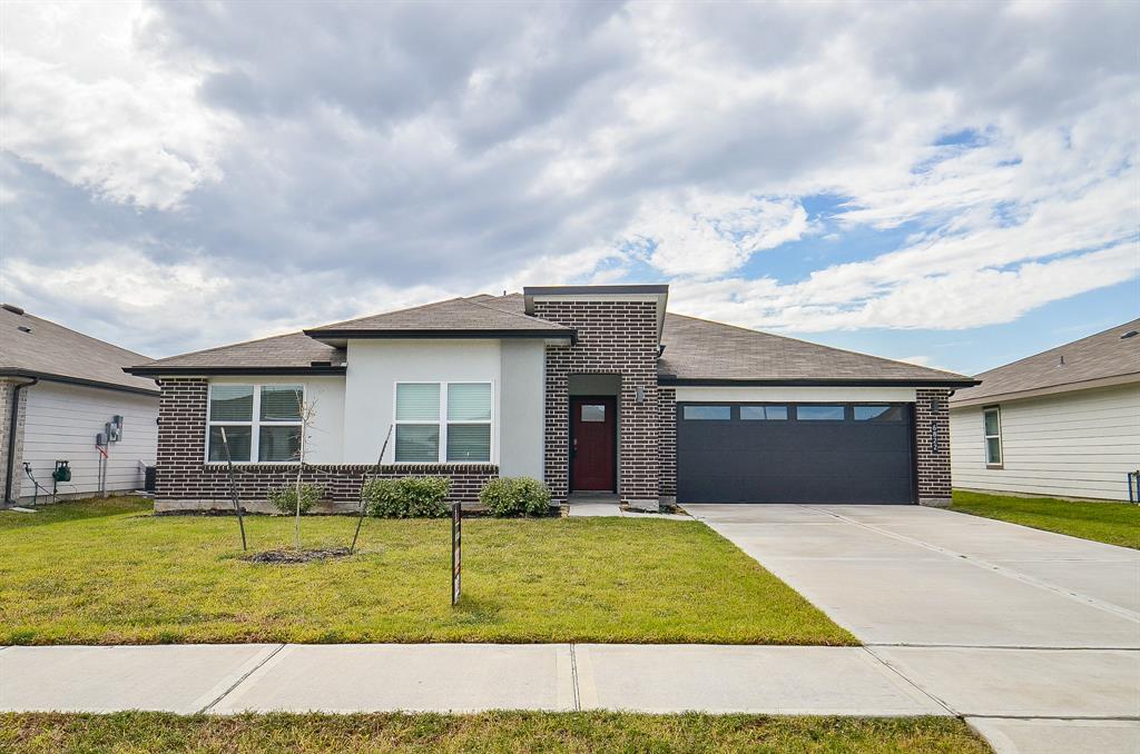 a front view of a house with garage