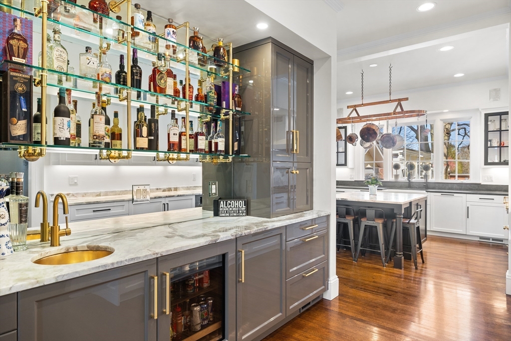 a kitchen with a sink and a refrigerator