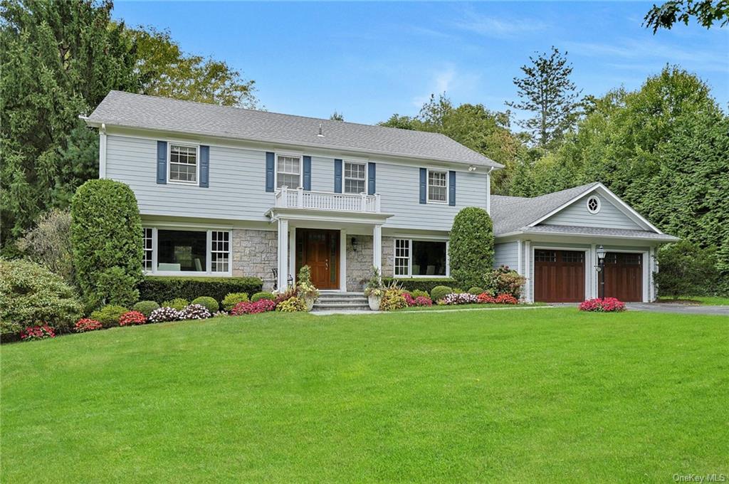 a front view of a house with a yard and porch