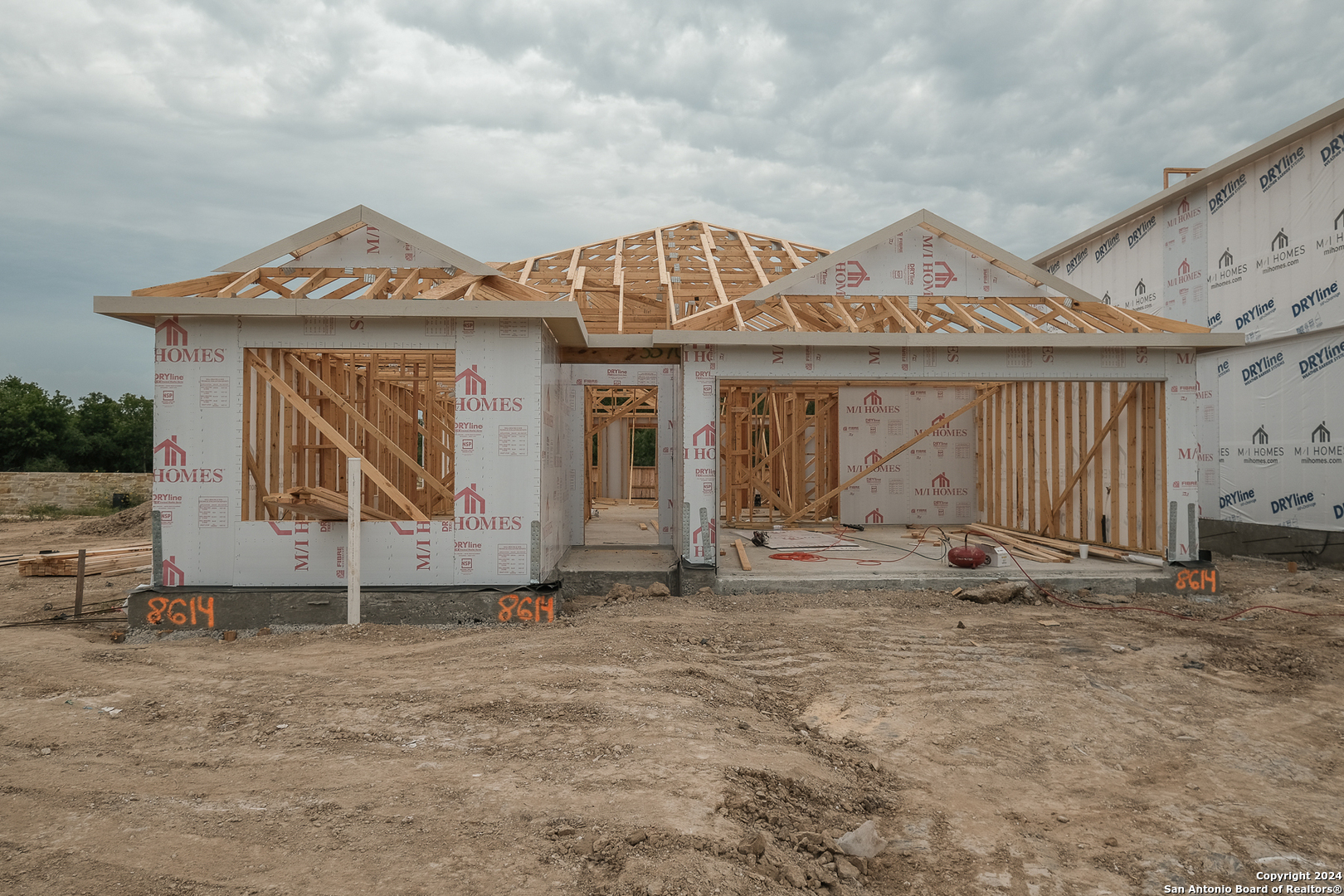 a front view of a house with garage