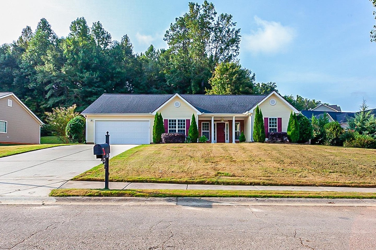 a house with trees in the background