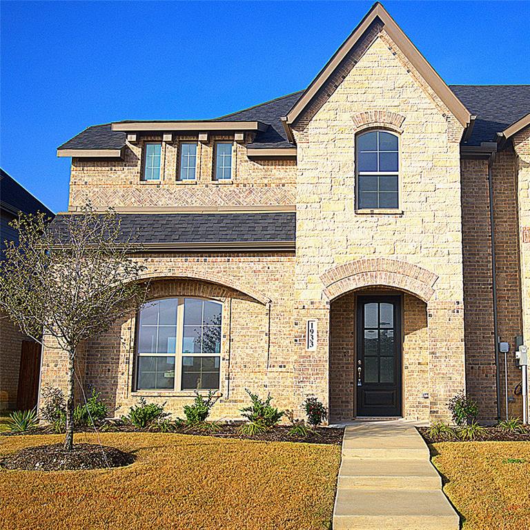 a front view of a house with yard