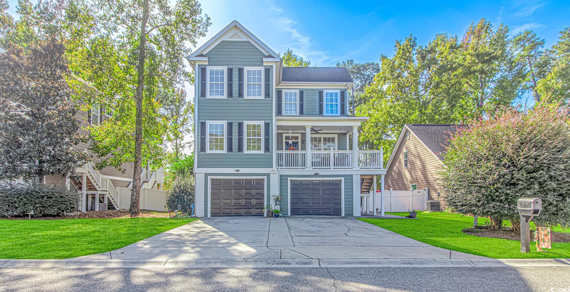 View of front property featuring covered porch, a