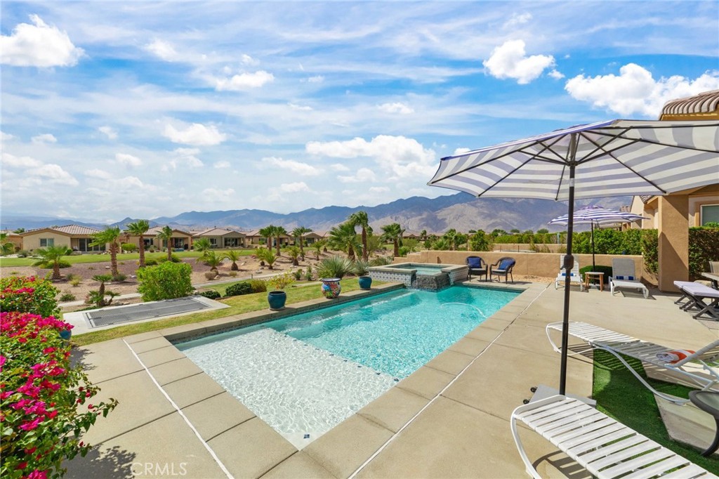 a view of a swimming pool with a patio