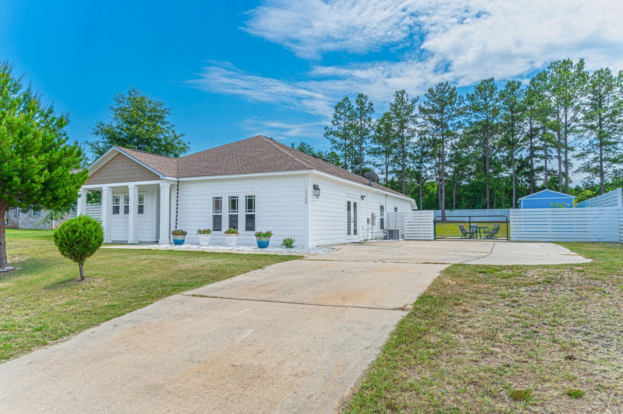 a front view of a house with garden