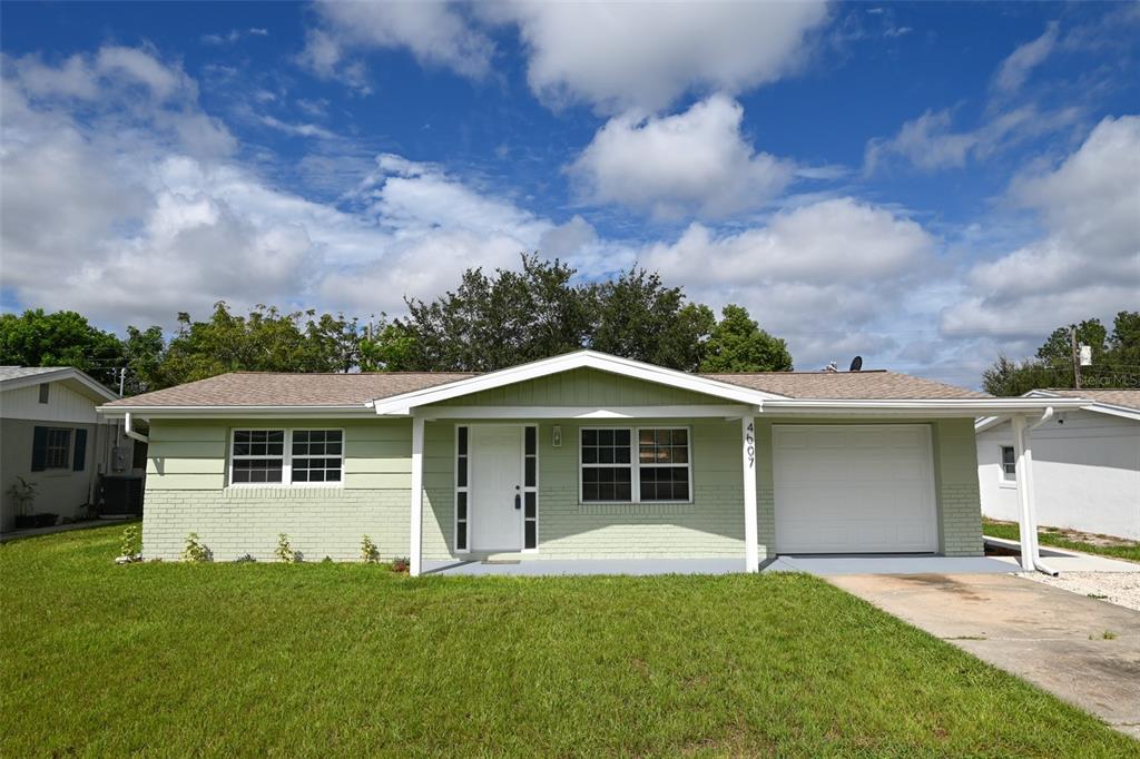 front view of a house with a yard